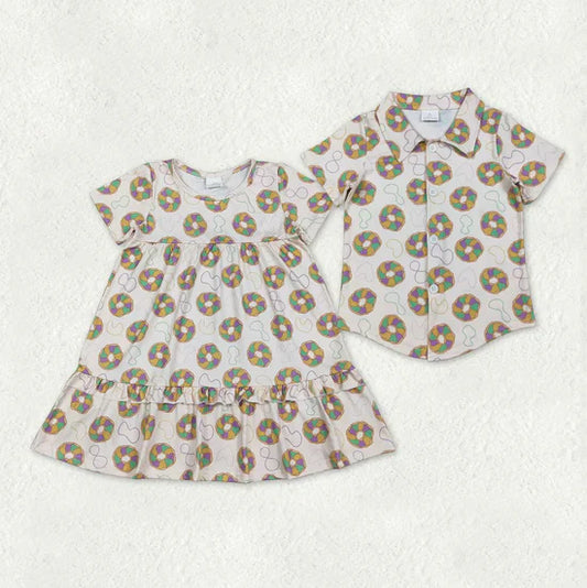 Sibling  Mardi Gras doughnut shirts and dress